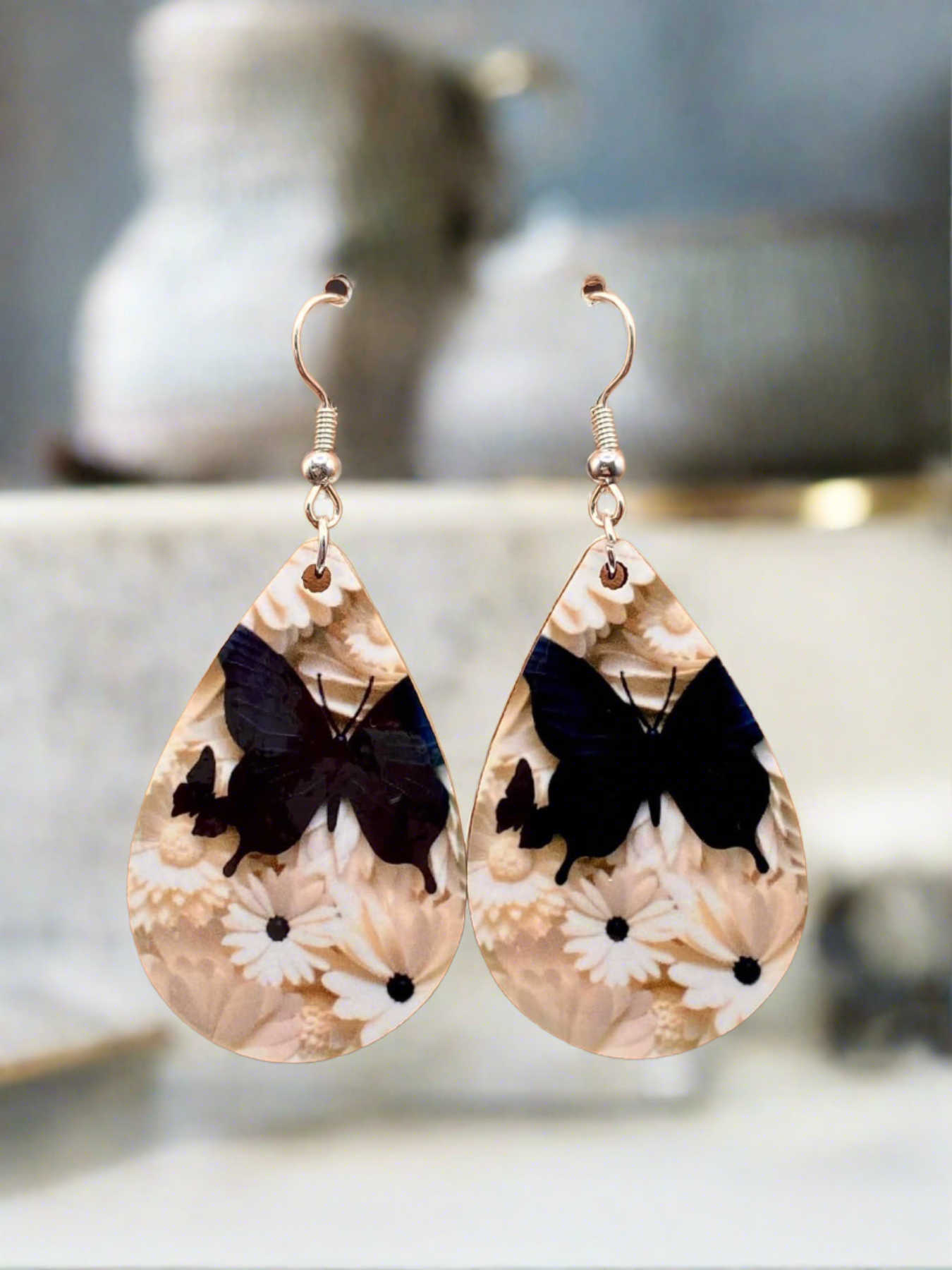 Whimsical Flutter: Elegant Black Butterfly and White Daisy Earrings